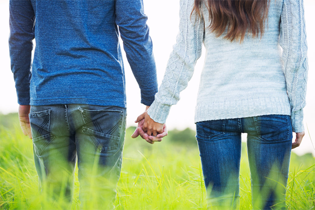 Couple holding hands