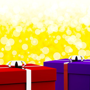 Red And Blue Gift Boxes With Yellow Bokeh Background As Presents For Him And Her